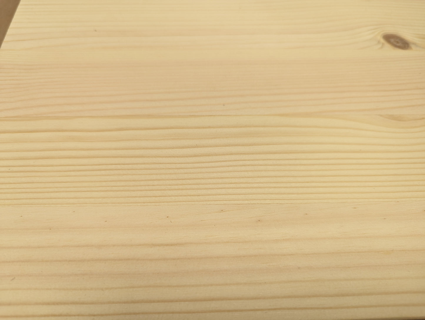Close-up of a wooden surface with visible grain pattern