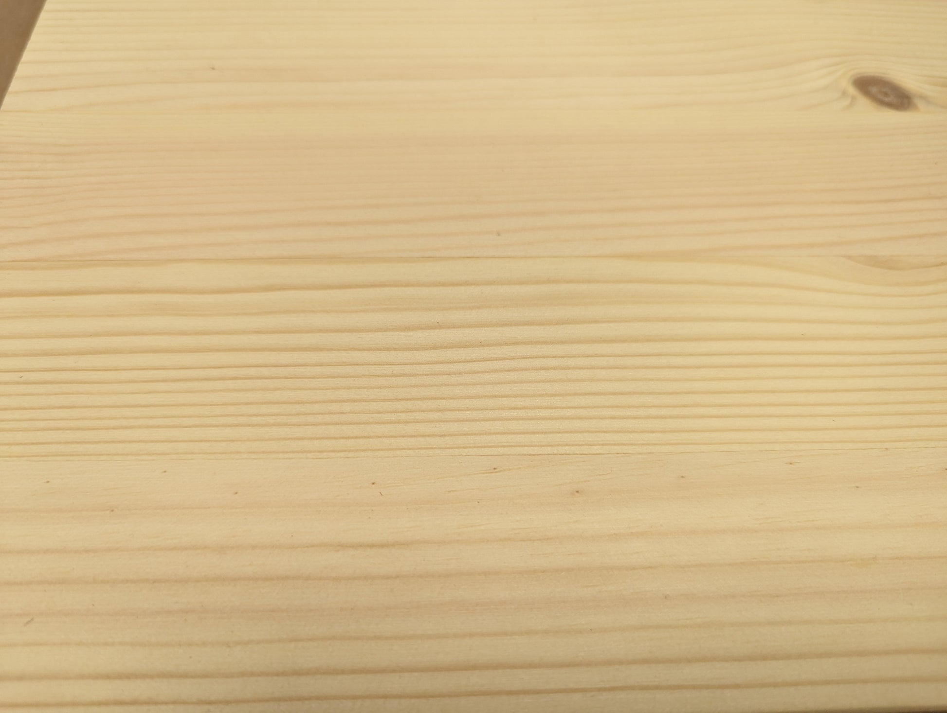Close-up of a wooden surface with visible grain pattern