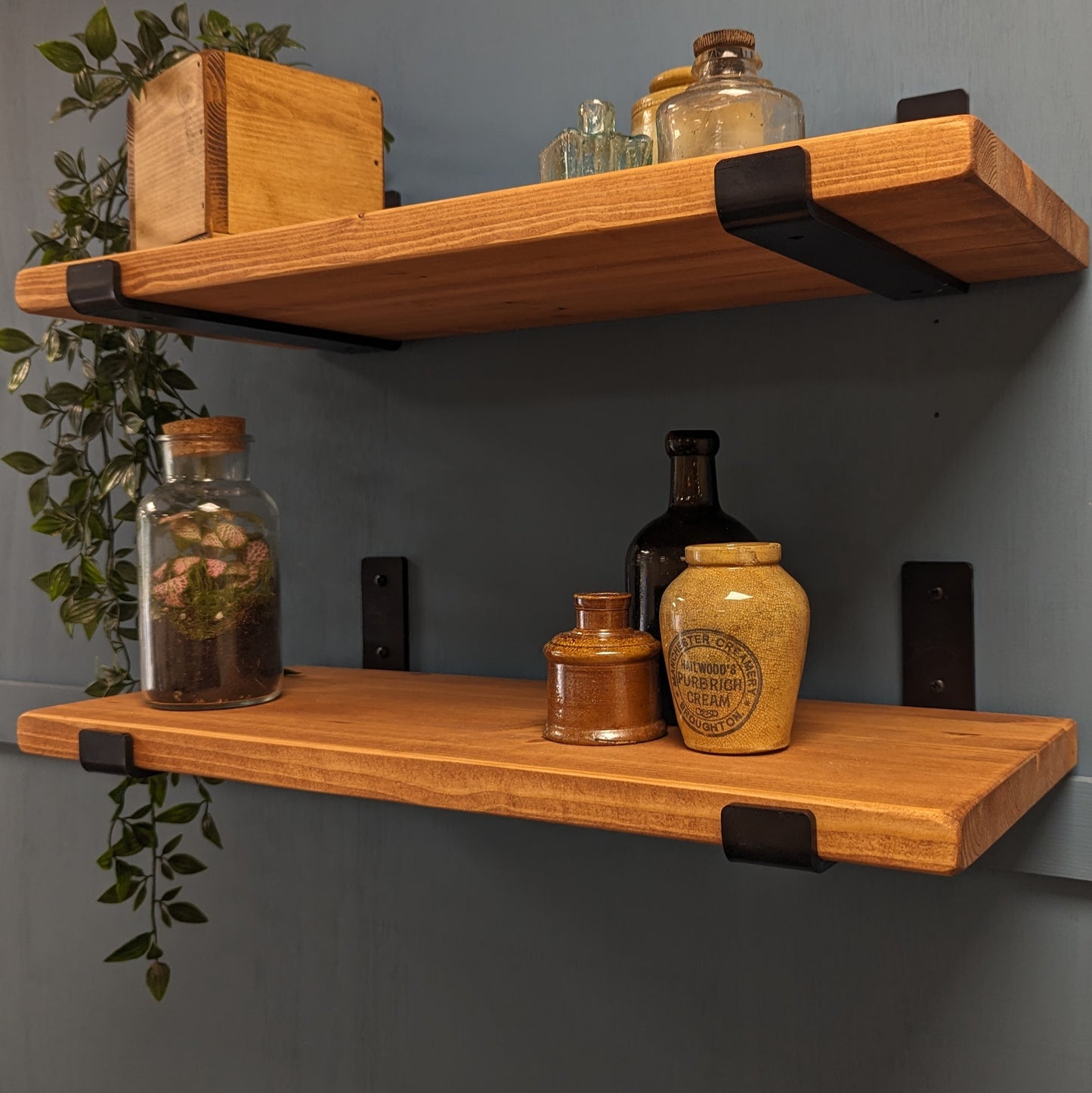 25mm Teak Wooden shelves with decorative jars against a gray wall
